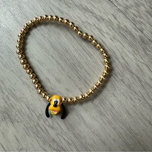 Gold Beaded Bracelet with Pluto face charm